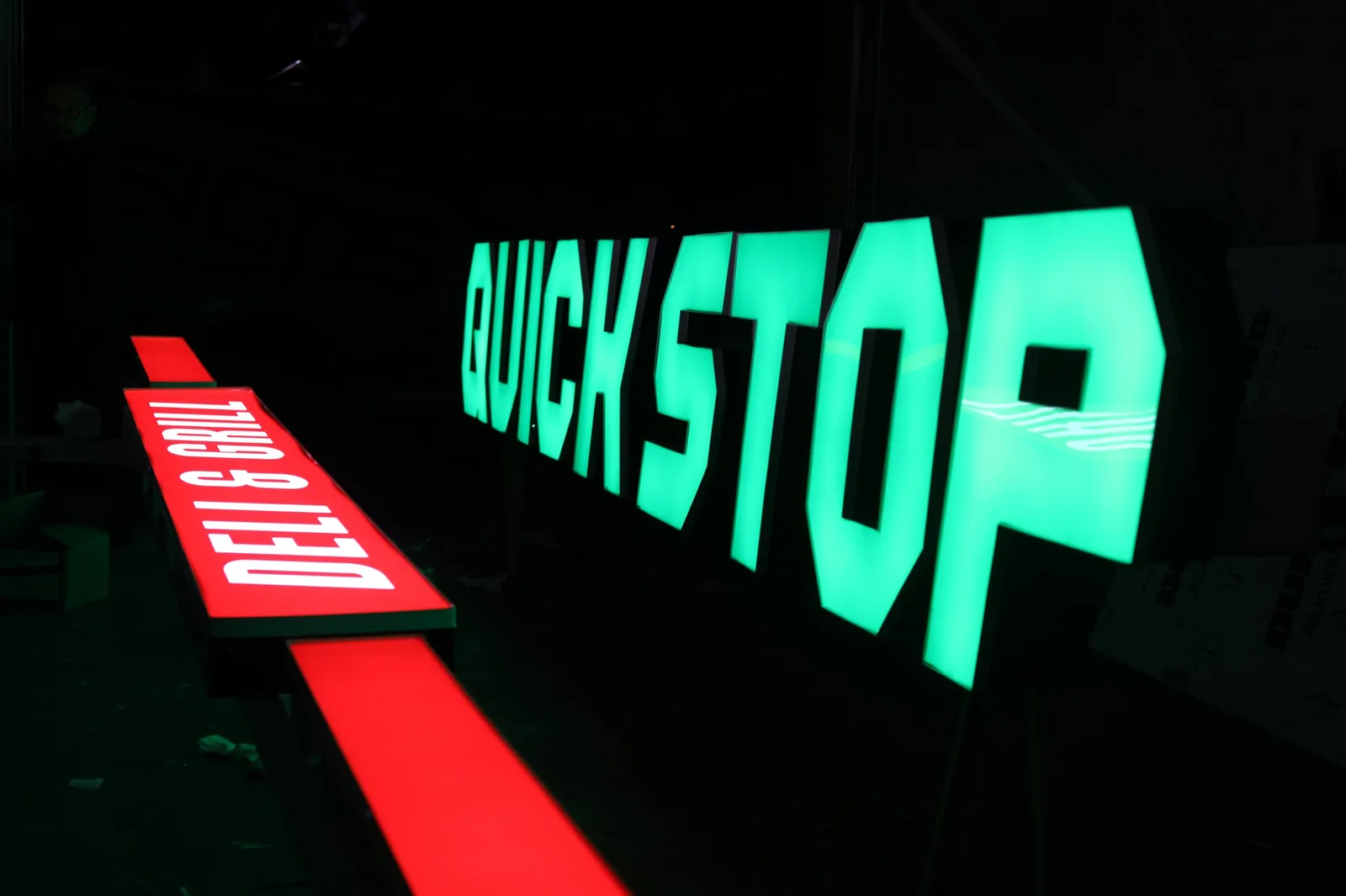 Illuminated channel-letter signage for Quick Stop Deli and Grill