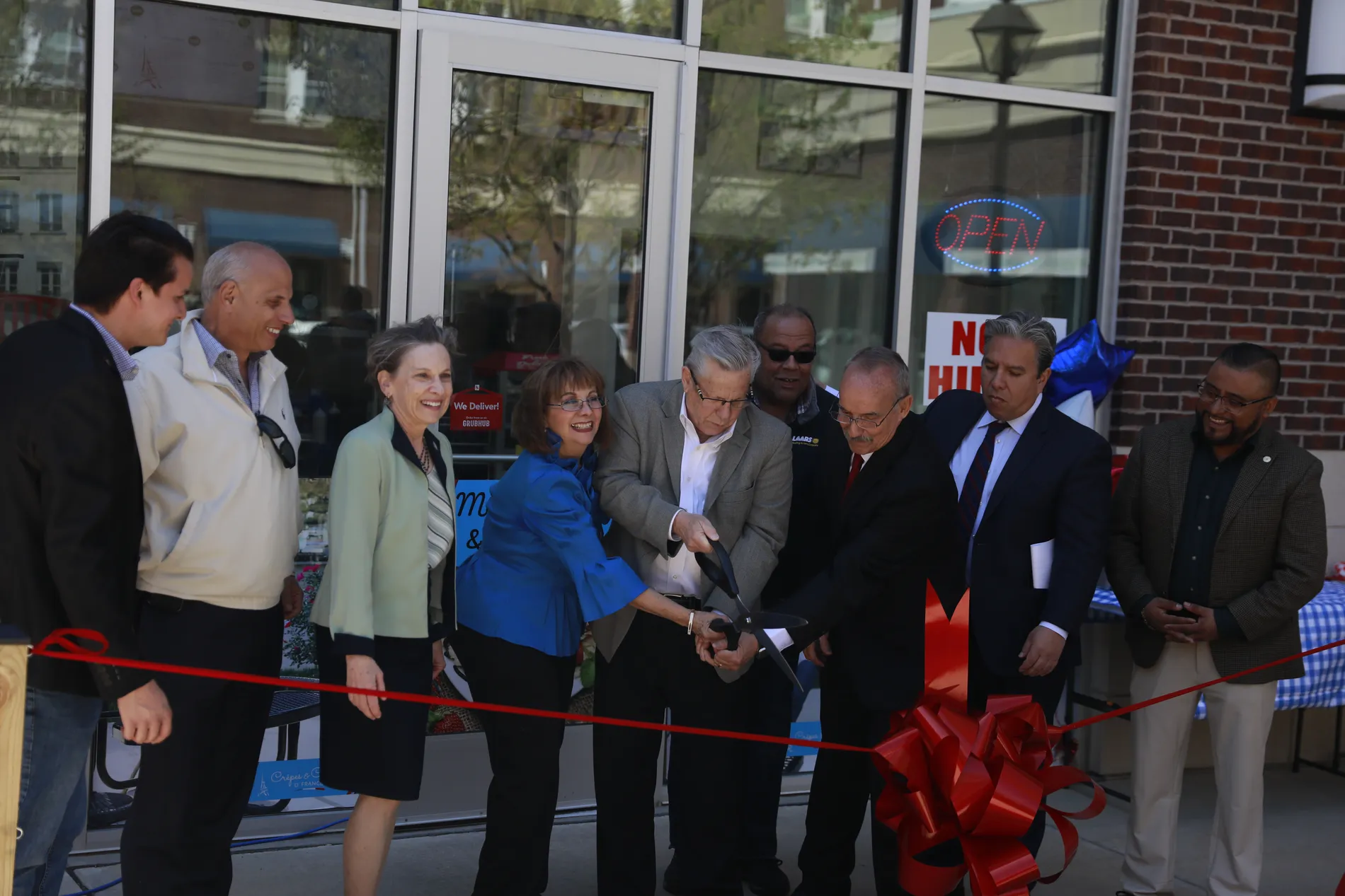 Ribbon cutting photographed at a business launch